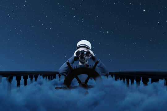 Digital composition of a helmsman with binoculars and cap over night clouds viewing to the starry sky