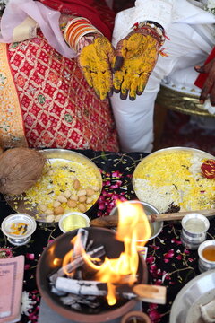 Indian wedding ritual where turmeric paste is applied to the bride's and groom's hands, symbolizing purity, prosperity, and blessings for their new journey together.