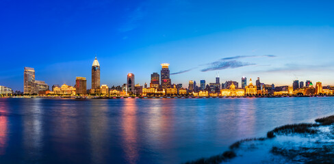 City skyline and modern business buildings scenery at night in Shanghai Bund. Famous city landmark background.