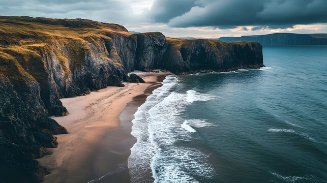 A secluded beach surrounded by rocky cliffs with waves crashing against the shore