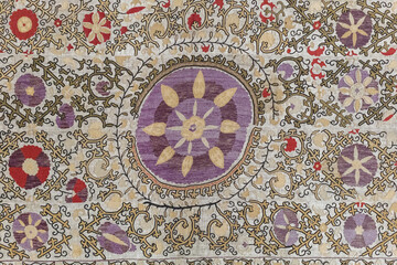 Colorful vintage surface with an old oriental pattern. The background is a texture that has a decorative value. For overlay or texture designs