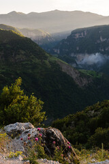 Golden hour before sunset in Albanian mountains, Progonat Albania.Valley with clouds. Mountains in the background