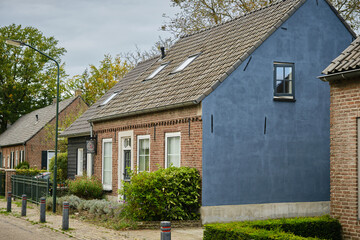 Typical street with renovated cottage's in Opwetten from late 20th century, near booming Eindhoven, in the south of the Netherlands.