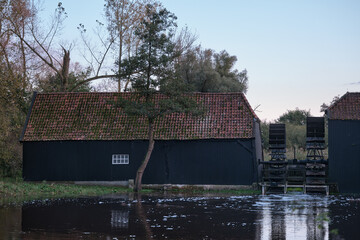 Typical Dutch Watermill 'Collse Molen' at dusk in the Netherlands, near the city of Eindhoven -...