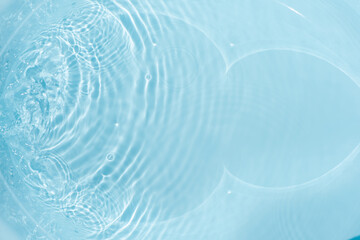 Blue water with ripples on the surface. Defocus blurred transparent blue colored clear calm water...