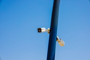 Fototapeta premium Surveillance camera video equipment for security system and detection of violations of society, zone control