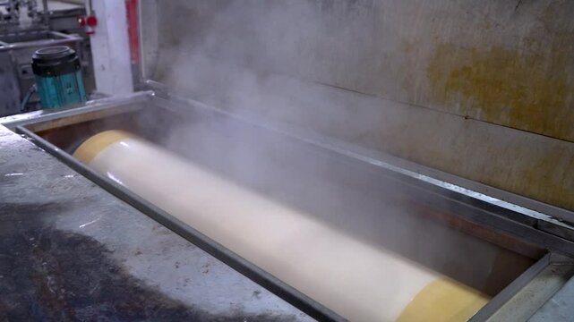 Close up image of a textile factory's cloth dyeing machine
