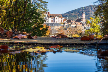 Autumn view of the old spa town of Baden-Baden reflected in a fountain, Germany