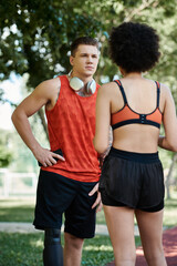 A young woman and her friend motivate each other during an energetic outdoor workout.