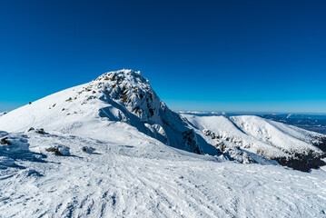 Derese hill in Nizke Tatry mountains with Mala Fatra, Velky Choc and Kubinska hola on the background in Slovakia during winter © honza28683