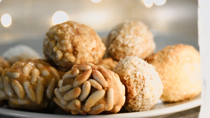 Panellets Dessert made with almonds, egg, sugar, pine nuts, traditional sweet from Catalonia, Spain; celebration 1 November, All Saints' Day.