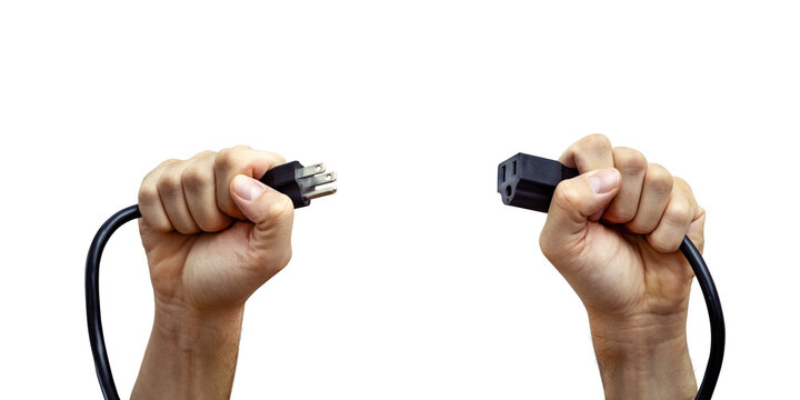 Hands Holding the Connectors of a US Power Cord Isolated from Background