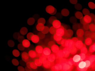 Abstract red light bokeh effect on a dark black background, creating a mesmerizing and atmospheric visual, background, light, atmospheric