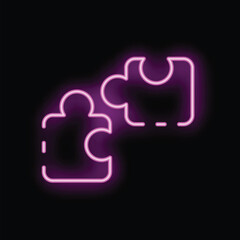 Neon sign of two puzzle pieces fitting together on a black background
