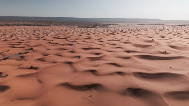 Drone shot over big dunes in morocco desert on sahara merzouga