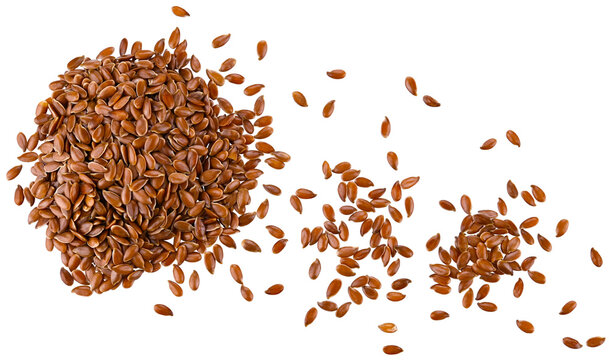 Scattered brown flax seeds isolated on a transparent background. Top view.