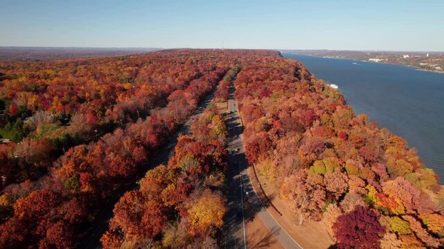 Aerial follow-shot of Palisades Parkway, NJ 9W in fall, 4K