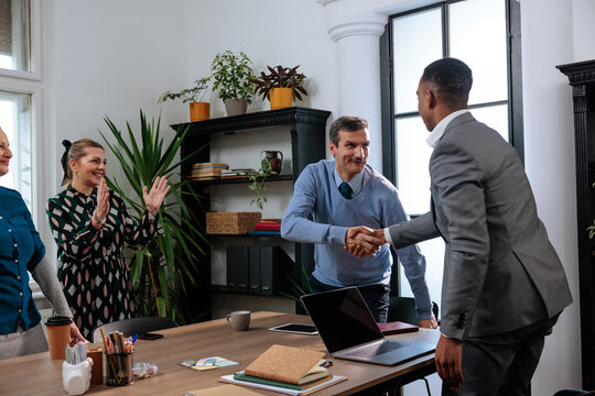Team congratulates their coworker