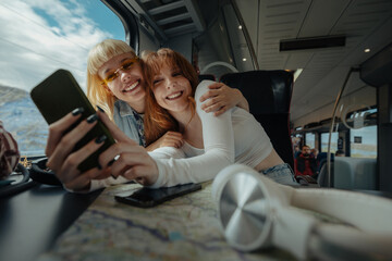 Women taking a selfie and smiling