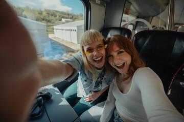 Two women with sunglasses smiling at camera