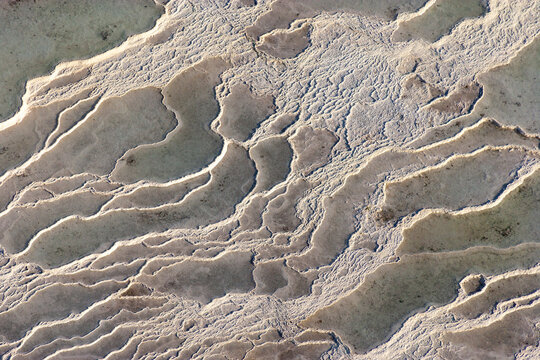 Aerial view of beautiful travertine formations and unique patterns at Pamukkale, Hierapolis, Denizli, Turkey.