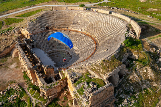 Aerial view of ancient ruins of Hierapolis with a scenic theater and green landscape, Denizli, Turkey.