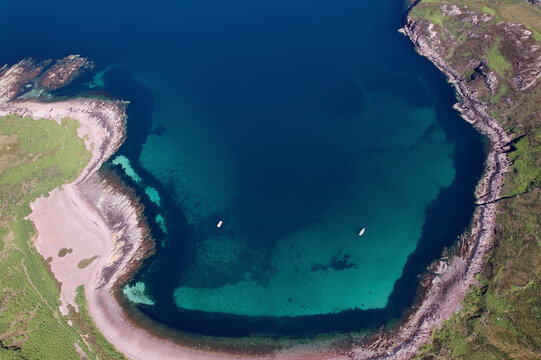 Aerial view of Joes Bay with a beautiful beach and blue ocean, Garve, Scotland, United Kingdom.
