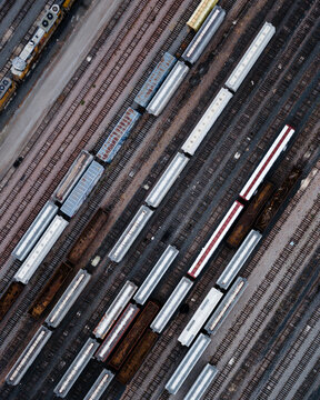 Aerial view of vibrant train yard with steel tracks and train cars, Fort Worth, United States.