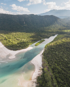 Aerial view of lush Daintree Rainforest with tranquil Noah Creek and scenic coastline, Cape Tribulation, Queensland, Australia.