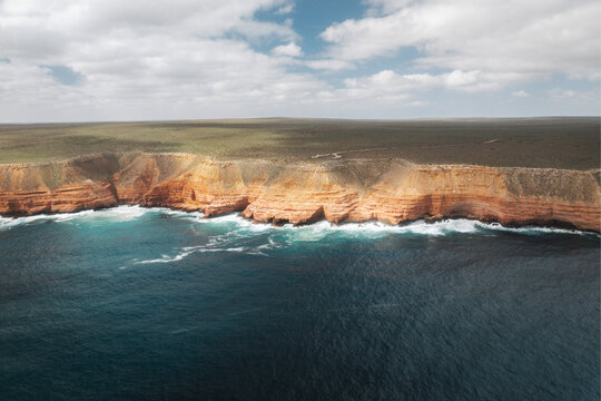 Aerial view of beautiful Shell House at Nancy Beach with rugged cliffs and serene ocean waves, Kalbarri National Park, Australia.