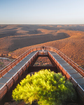 Aerial view of kalbarri skywalk overlooking beautiful arid landscape with trees and people, Kalbarri National Park, Australia.
