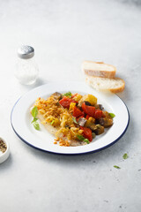 White fish fillet with onion crunch and vegetables