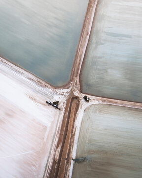 Aerial view of colorful salt marshes with geometric patterns and natural textures, Useless Loop, Australia.