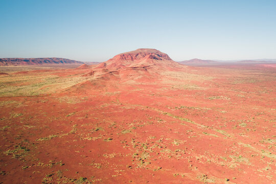 Aerial view of Mount Bruce in a rugged and barren landscape, Karijini National Park, Western Australia, Australia.