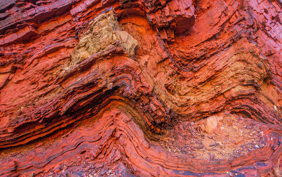 Aerial view of iron ore deposits and rugged rock formations in Hamersley Gorge, Karijini National Park, Tom Price, Australia.