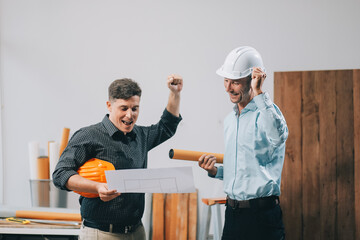 Team Engineers with draft plan of building on constructing site. Engineer work on site. engineer visit and inspection site engineer. Inspector engineer check and working on site.