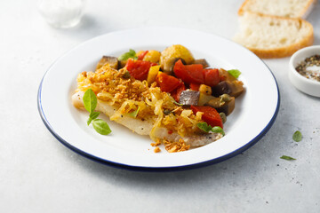 White fish fillet with onion crunch and vegetables