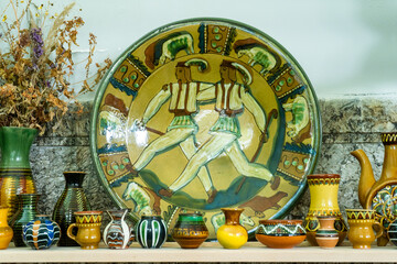 Clay ceramic decor painting. Carpathian Hutsuls old Ukrainian plate and Vase