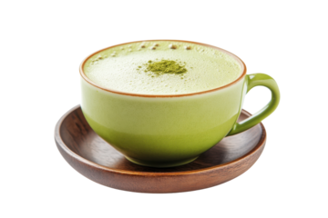 Savoring a creamy cup of matcha green tea in a charming wooden setting on a cozy afternoon
