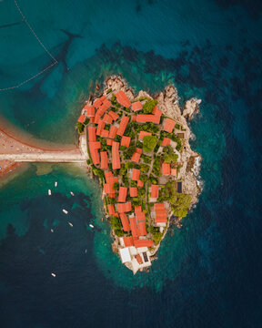 Aerial view of Sveti Stefan Peninsula, a small township in Mediterranean Sea in Balkans peninsula near Budva, Montenegro.