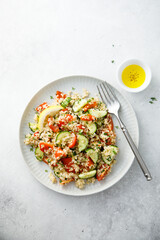 Healthy quinoa salad with tomatoes and cucumber