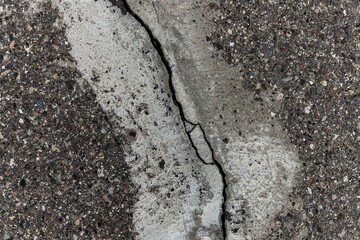 Asphalt with destroyed cracked surface for textures or layouts