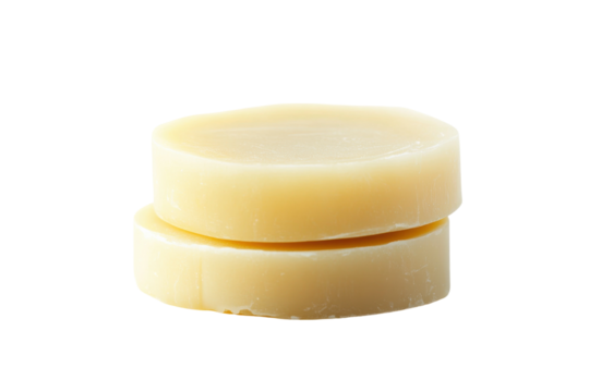 Natural handmade soap bars stacked on a clean surface with a minimalist aesthetic