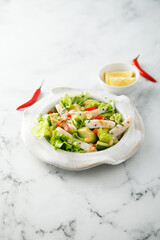 Squid salad with avocado and peanuts