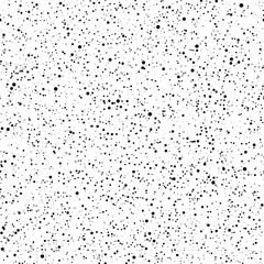 Obraz premium Seamless black ink dot texture on white background with random scatter pattern