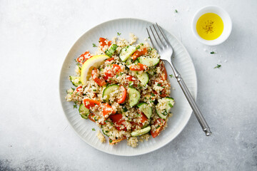 Healthy quinoa salad with tomatoes and cucumber