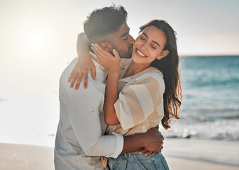 Happy, kiss or couple hug at beach for love on vacation, valentines day or holiday in Spain....