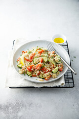 Healthy quinoa salad with tomatoes and cucumber
