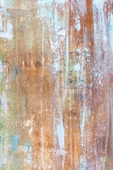 Aged faded colored grunge background with textured surface for design or background