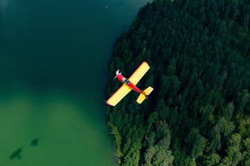 Aerial view of serene Ivanovo Natural Park with lush forest and tranquil lake, Pochinkovskiy, Russia.